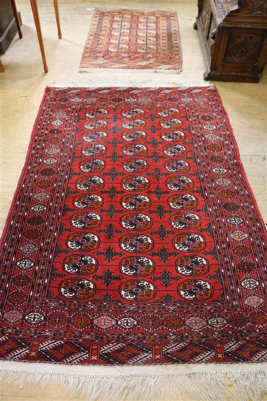 Large Bokhara red rug and one other faded